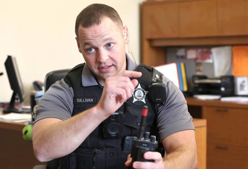 Chris Sullivan, DeKalb Police officer and student resource officer at DeKalb High School, talks Thursday, Oct. 20, 2022, at the school, about what he enjoys most about working with students and some of the challenges that it can create.