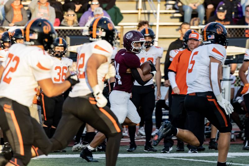 Lockport's Chris Miller eyes the defense during a varsity football home game against Lincoln-Way West on Sept. 5, 2025.