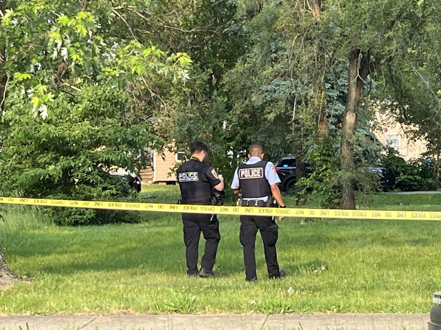 Joliet police officers investigating the scene of a reported shooting in the 300 block of Des Plaines Street on Monday, June 2, 2025.