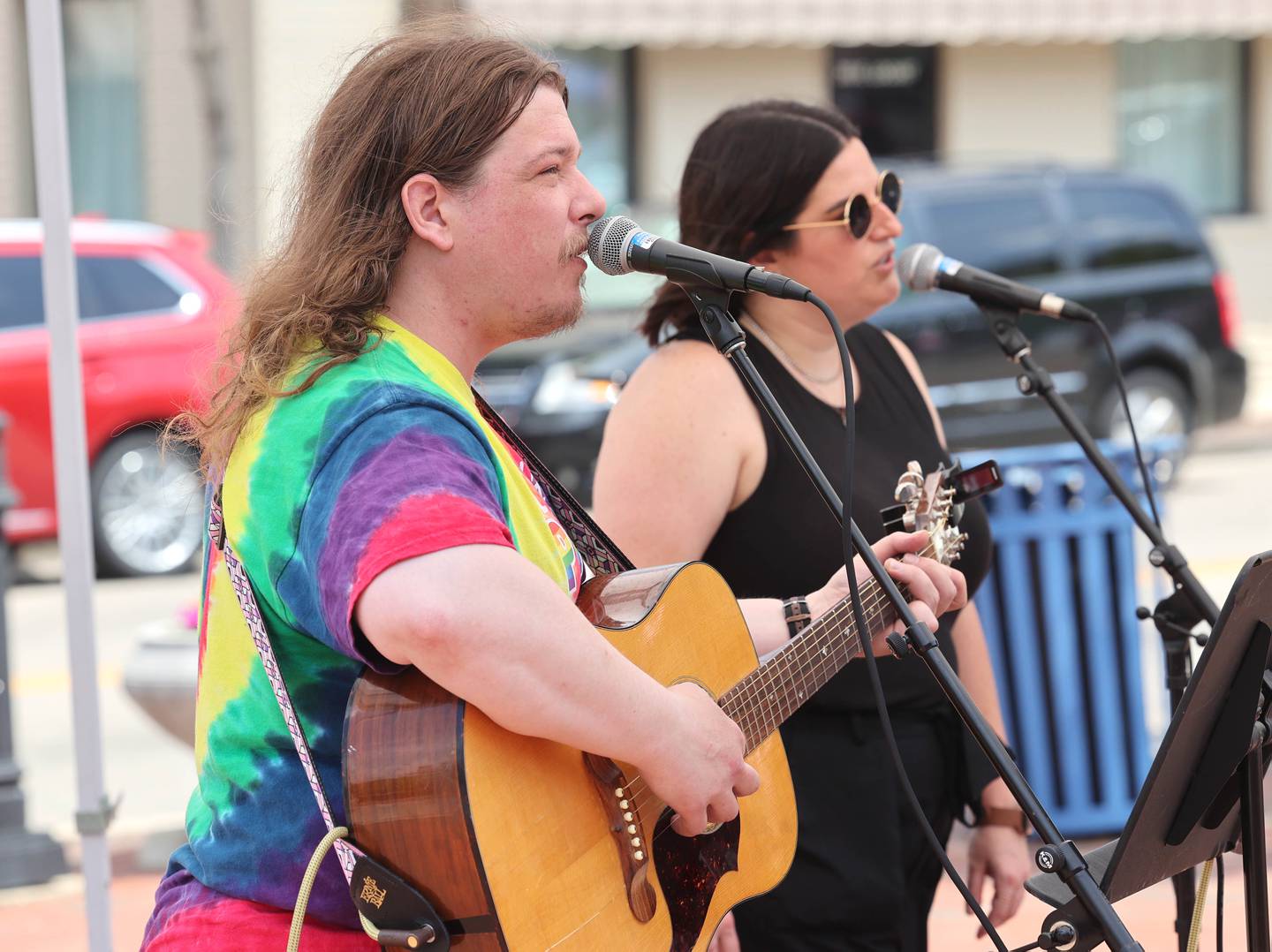 Peter Lindsey and Jeanine Holcomb, members of the band PB&J perform during opening day for the DeKalb Farmers Market Thursday, June 1, 2023, at Van Buer Plaza in downtown DeKalb. The Farmers Market is open every Thursday from 10 am to 2 pm through September 21.