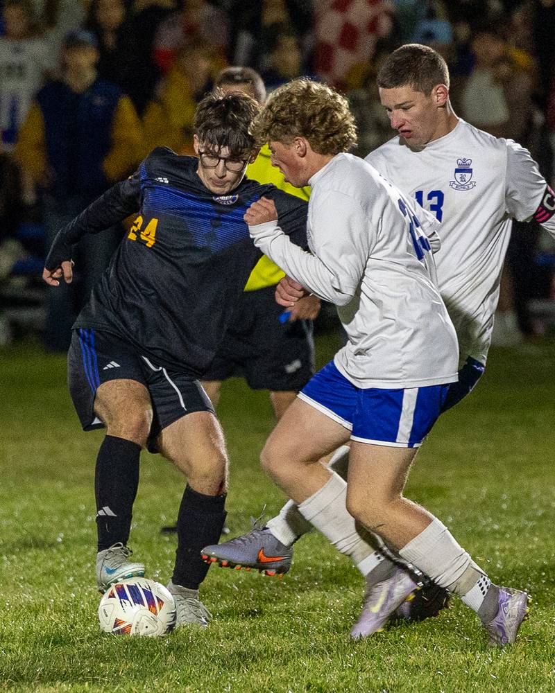 Nolan Kerley (24) of Somonauk/Leland/Newark dribbles ball as Liam Bird (29) of Hinckley-Big Rock attempts to steal during the Little Ten Conference Championship match on Thursday, Oct. 9, 2025 at Hinckley-Big Rock School in Hinckley.