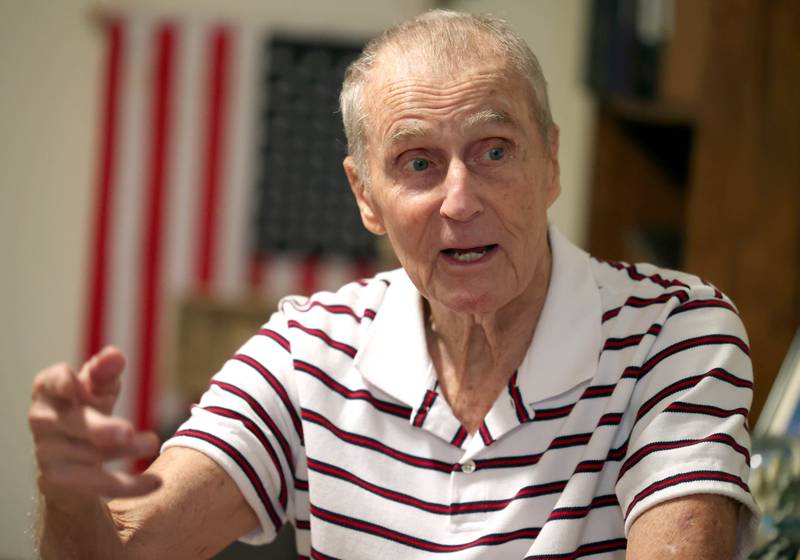 U.S. Army Veteran Jerry Busby talks about his time in the service Wednesday, Aug. 28, 2024, at his DeKalb home. Busby has amassed a large collection of military memorabilia over the years that cover the walls of his basement.