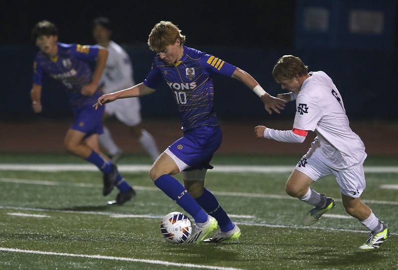 Lyons Township's Haris Sarajlija controls the back in front of New Trier's Ian Vichnick during the IHSA Class 3A state championship soccer match on Saturday, Nov. 4, 2023, at Hoffman Estates High School.