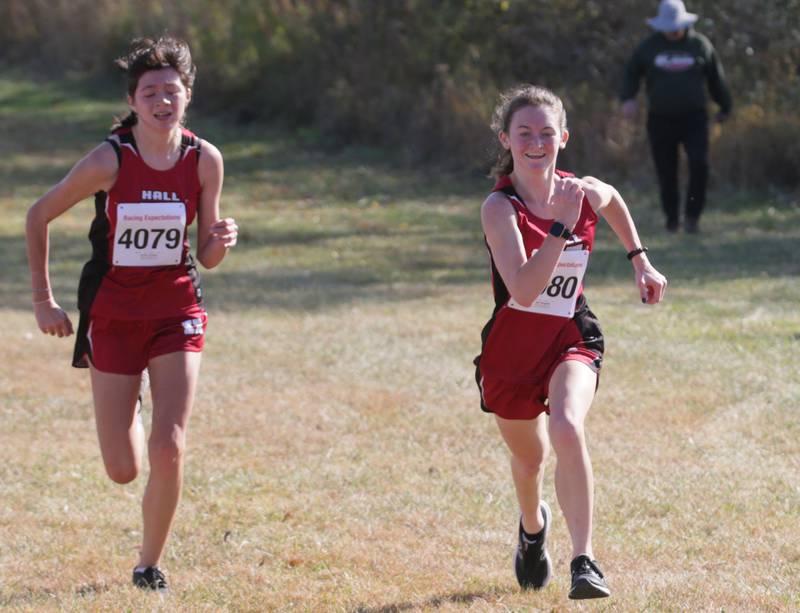 Hall's Evelyn Castelan and Jade Wangelin runs in the Class 1A Regional Cross Country gils race on Saturday, Oct. 22, 2022 at the Seneca FFA Farm in Marseilles.