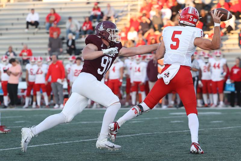 Lockport’s Brian Kwiatkowski puts pressure on Naperville Central’s Sebastian Hayes on Oct. 4, 2024 in Lockport.