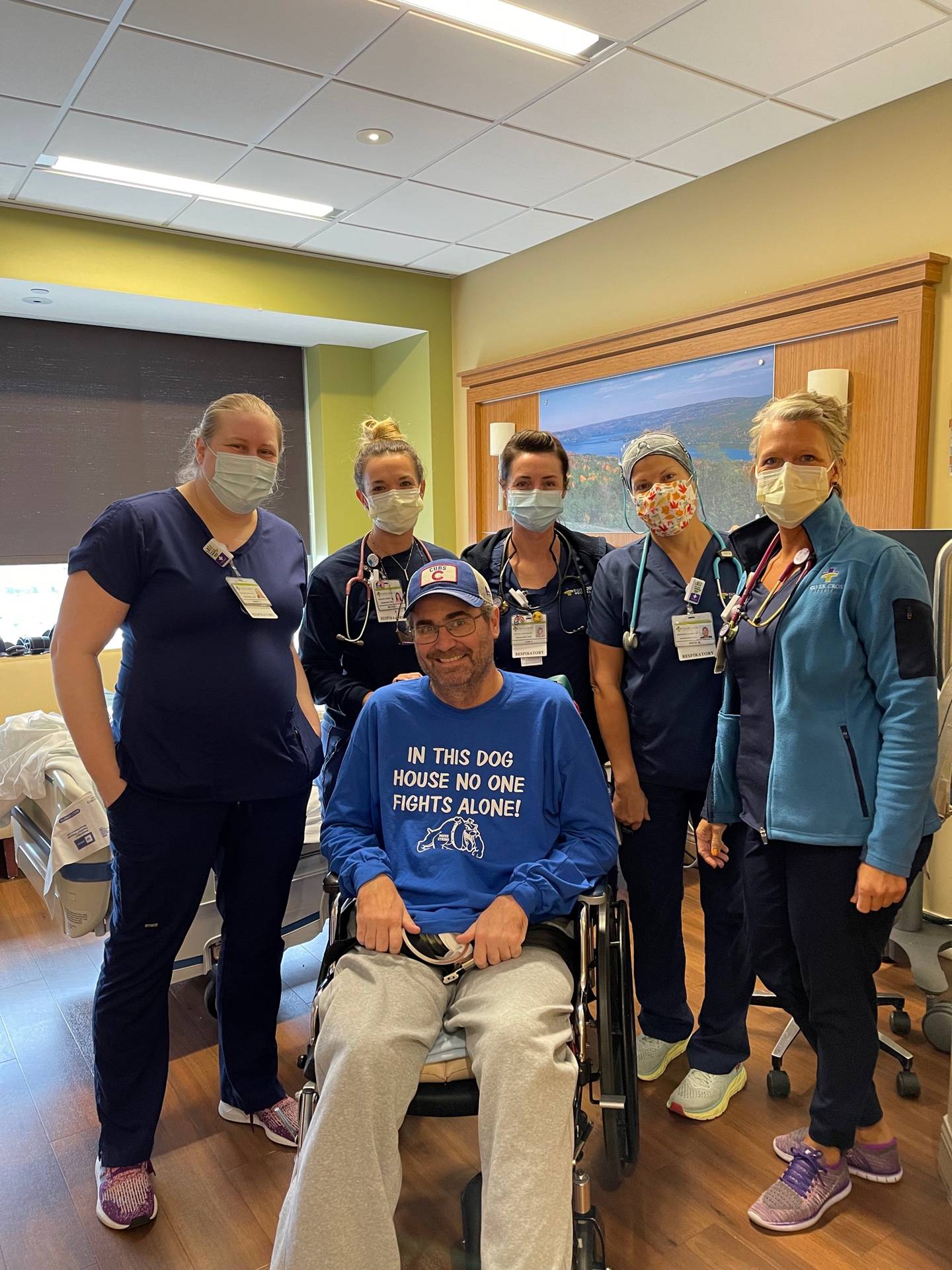 Brad Moss of Tinley Park was admitted to Silver Cross Hospital in New Lenox due to COVID-19. He was not released until Nov. 12, 2022. He is pictured with Silver Cross respiratory therapists.