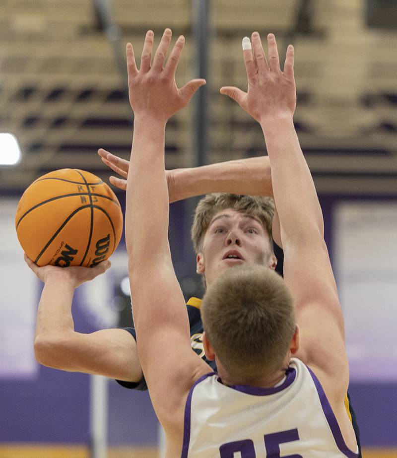 Sterling’s Jack Saathoff puts up a shot against Rochelle’s Eli Schweitzer Saturday, Jan. 3, 2026.