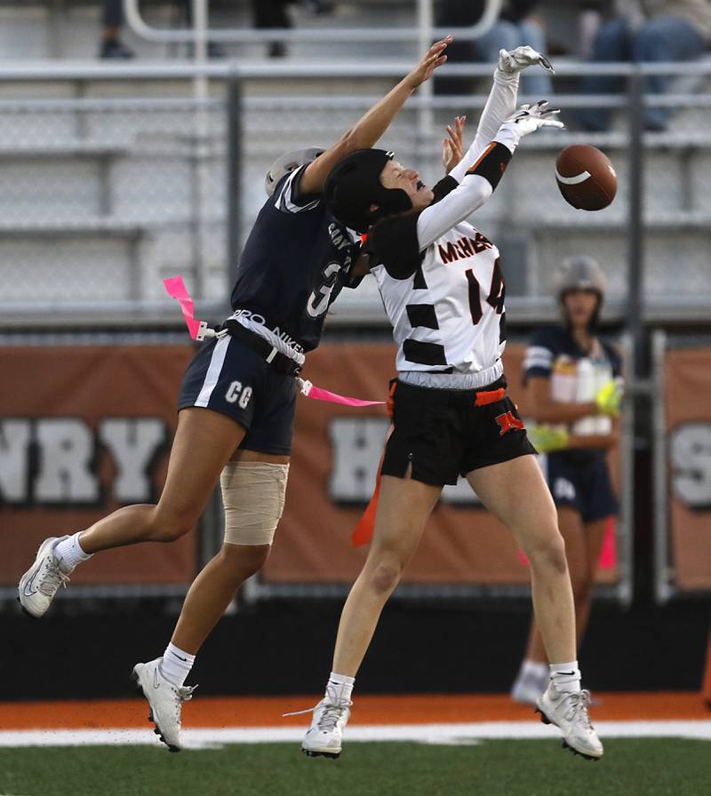 Cary-Grove's Kennedy Manning breaks up a pass intended for McHenry's Morgan Frederick during the IHSA McHenry Regional girls flag football championship game on Wednesday, Oct. 8, 2025, at McCracken Field in McHenry.