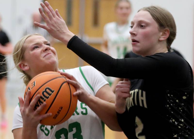 Crystal Lake South's Laken LePage drives to the basket against Grayslake North's Ashlyn Stoneham during a Northern Illinois Holiday Classic semifinal girl basketball game on Tuesday, Dec. 16, 2025, at McHenry High School.