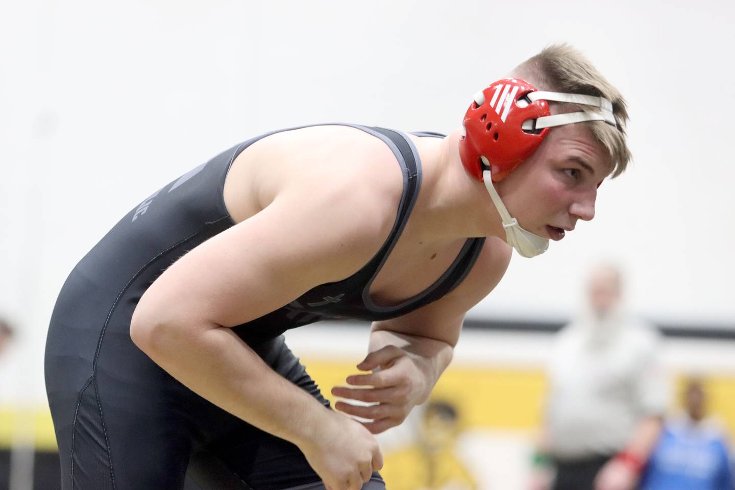 Marian’s Jimmy Mastny faces off against Woodstock North’s David Randecker at 215 pounds in boys wrestling IHSA Class 2A Regional championship bout action on Saturday, Jan. 31, 2026, at Harvard High School in Harvard.