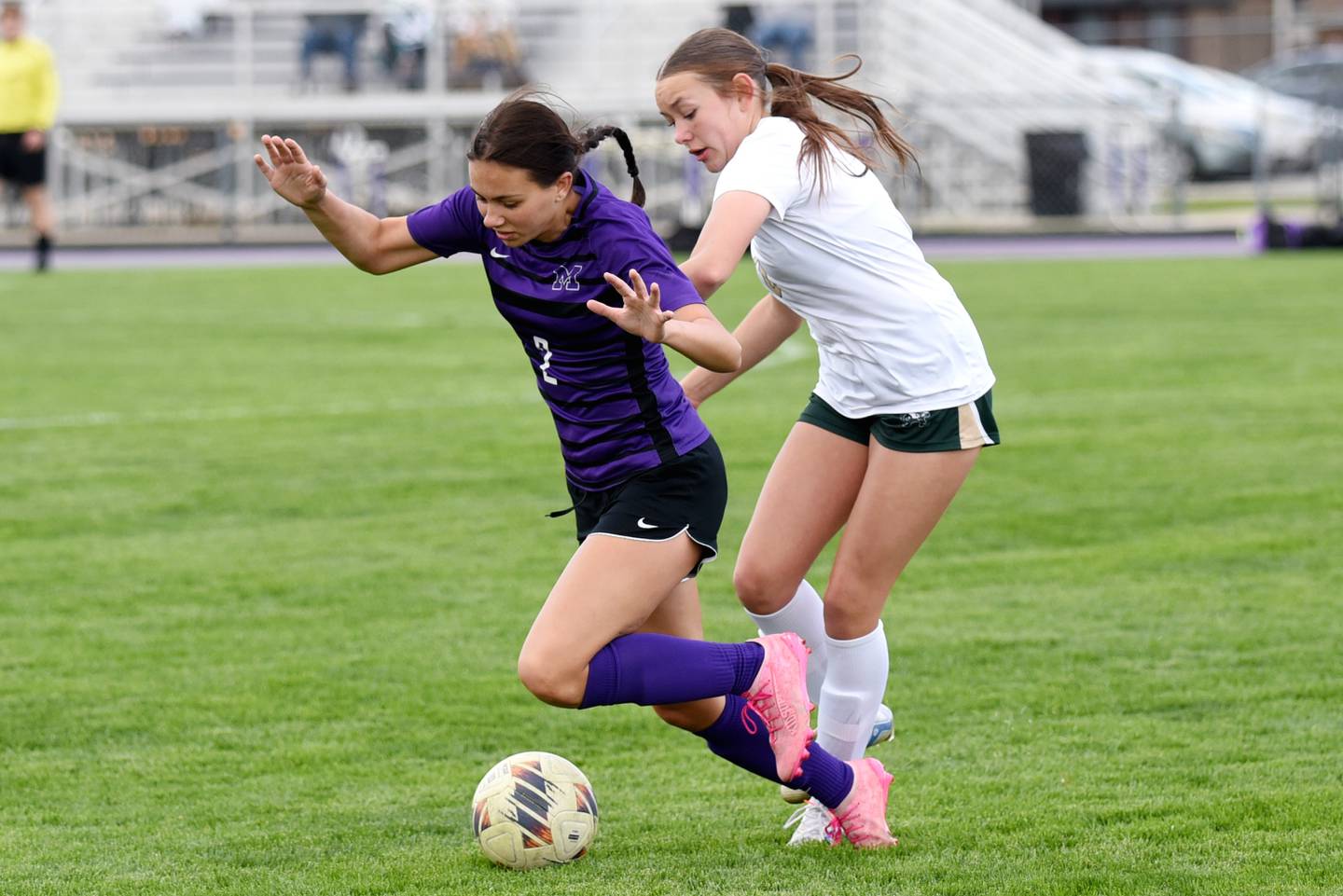 Manteno's Peyton Boros, left, and Bishop McNamara's Tatum Smith collide in pursuit of a loose ball during a game at Manteno Wednesday, April 29, 2026.