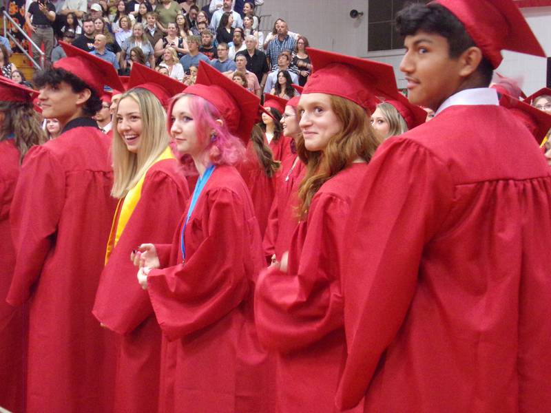 A row of students in the Streator High School Class of 2023 smile at the beginning of the graduation ceremony Sunday, May 21, 2023.