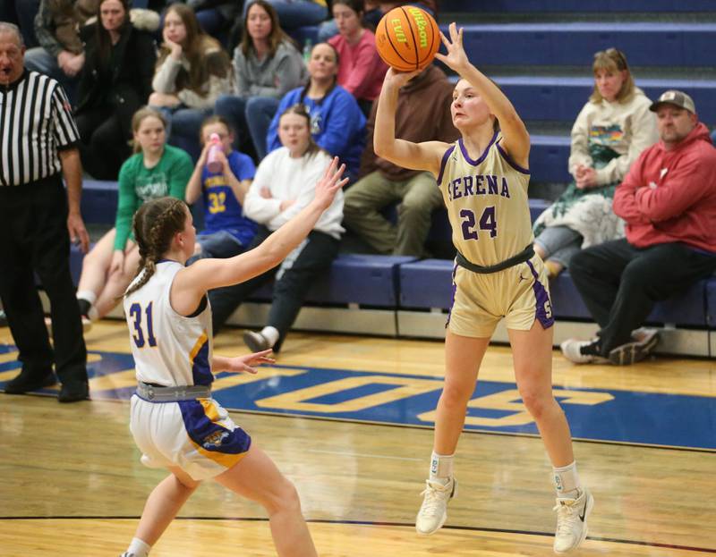 Serena's Anna Hjerpe (24) lofts a jumper over the outstretched arms of Somonauk/Leland defender Allayna Wold during a 2024-25 Little Ten Conference game at Somonauk High School.