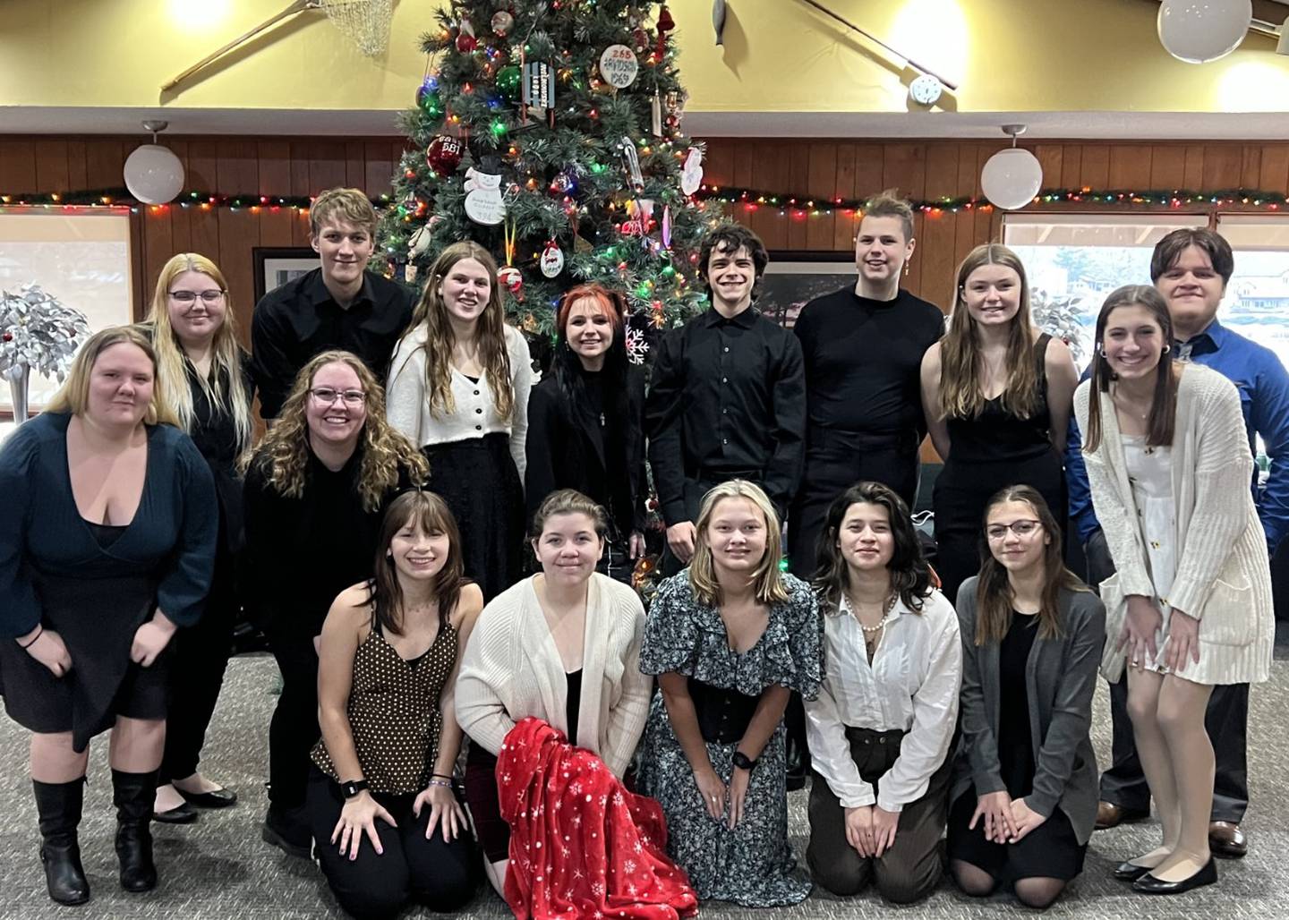 Taylor Marshall (third from left) with the madrigal ensemble December 13, 2022, performing for the Lake Holiday Ladies Club.