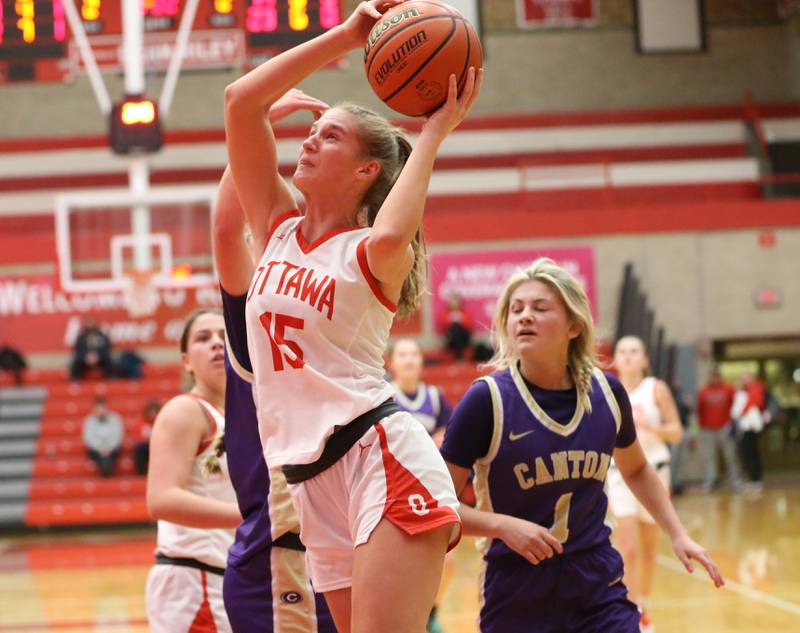 Ottawa's Hailey Larsen sprints to the basket to score over Canton's Ava Wenger during the Lady Pirate Holiday Tournament on Wednesday, Dec. 21, 2022 in Ottawa.