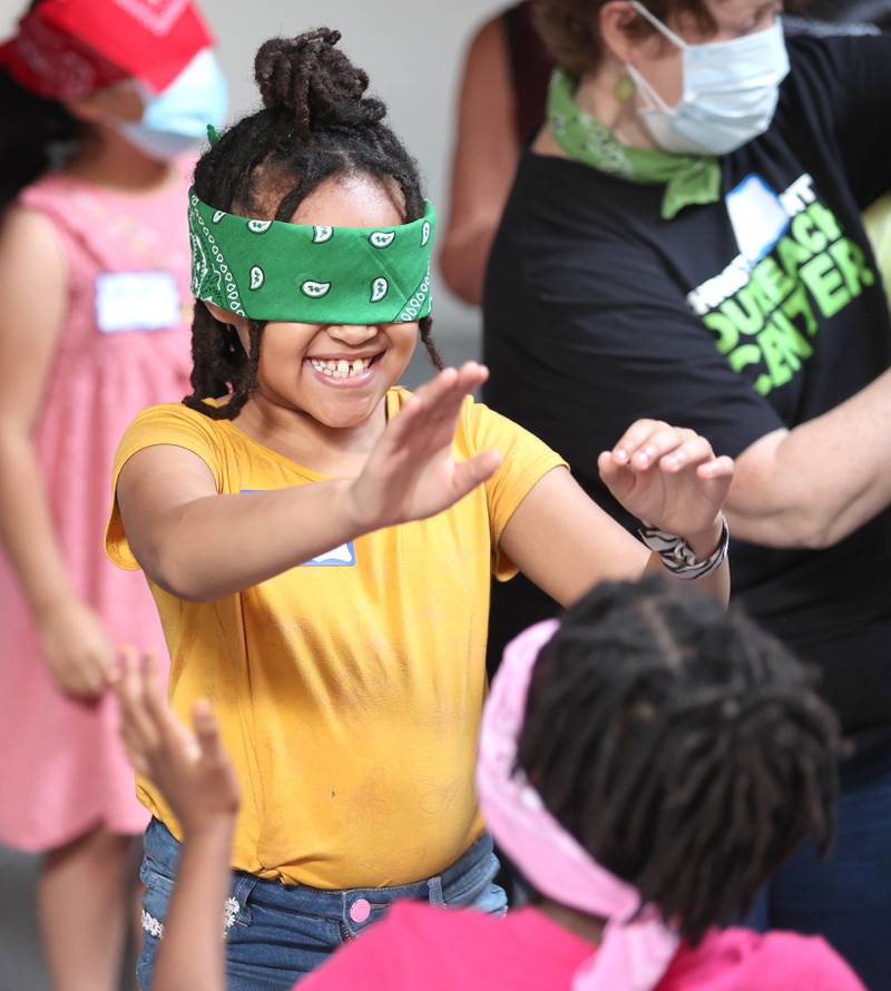 Jameya Taylor, 7, from DeKalb, participates in an activity about the noises heard on a farm Monday, July 11, 2022, during of a session of Summer Reading Vacation put on by Neighbors' House in DeKalb in conjunction with the DeKalb County Farm Bureau. Christ Community Church is hosting the camp this week in their outreach center on North 6th Street in DeKalb.