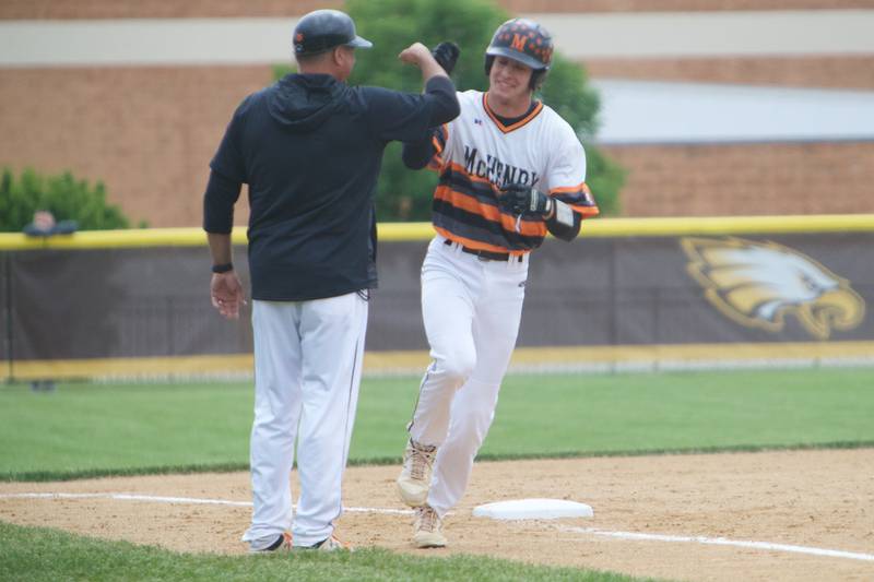 McHenry's Conner Rodgers rounds thirdbase after hitting a home run against Huntley at the Class 4A Sectional Final on June 4, 2022 in Algonquin.