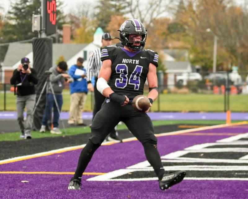 Downers Grove North's Jake Gregorio (34) celebrates after scoring a touchdown while taking on Fenwick High School during the second week of the class 3A game on Saturday Nov. 9, 2024, held at Downers Grove North.