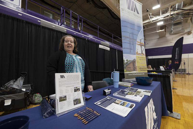 Liz Reyes, administration assistant at Willett Hofmann, talks about the company Wednesday, March 11, 2026, during a career fair at Dixon High School.