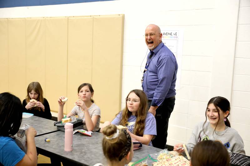Principal Ron Zeman chats with fifth graders during their lunchtime. Zeman will be retiring June 30 from Western Avenue Elementary School in Geneva. He has been in education for 33 years, 23 of them as an administrator, 8 as teacher, 5 as special ed coop consultant.