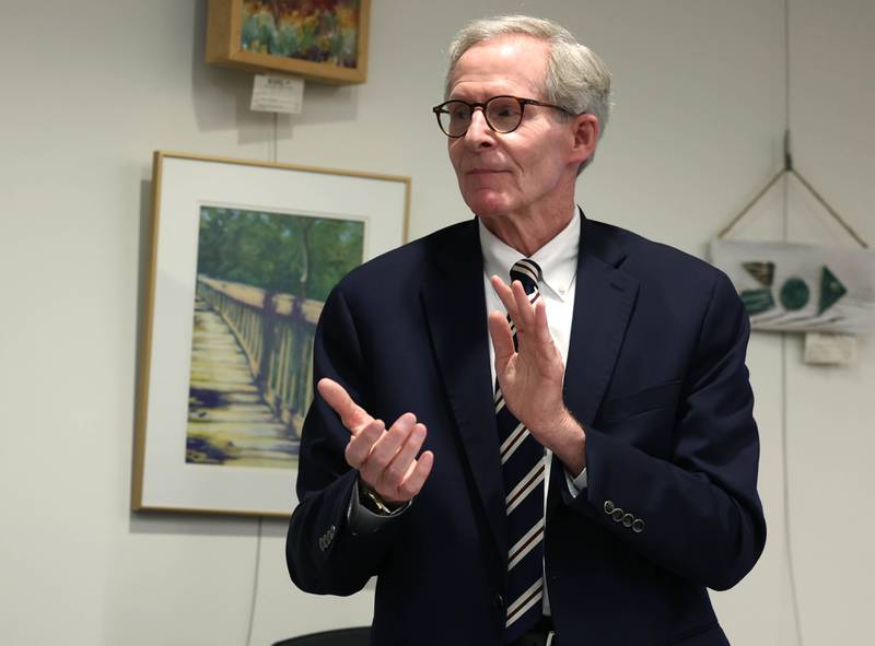 DeKalb City Manager Bill Nicklas applauds as retiring DeKalb Fire Chief Mike Thomas is thanked for his service Monday, June 23, 2025, during the DeKalb City Council meeting at the DeKalb Public Library.