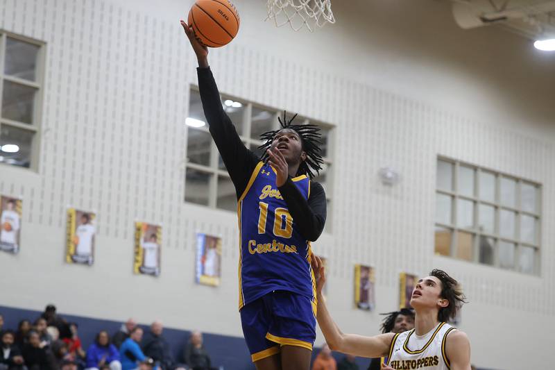 Joliet Central’s James Lee lays in a basket against Joliet Catholic on Tuesday, Jan 20, 2026 in Joliet.