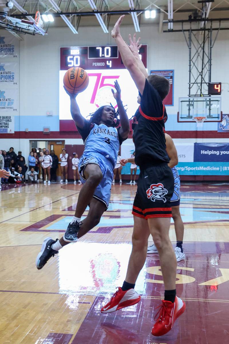 Kankakee's Cedric Terrell III looks to shoot after drawing a foul late in the fourth quarter during the Kays' 54-50 victory over Lincoln-Way Central in the 75th Kankakee Holiday Tournament maroon bracket championship on Sunday, Dec. 28, 2025.