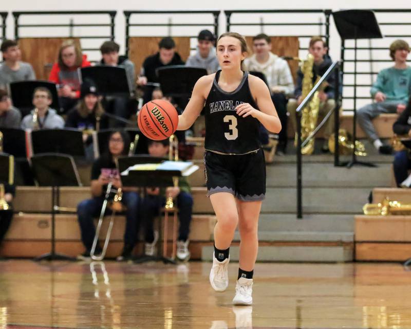 Kaneland's Alexis Schueler (3) advances the ball during varsity basketball game between Kaneland at Yorkville. Dec 14, 2022.