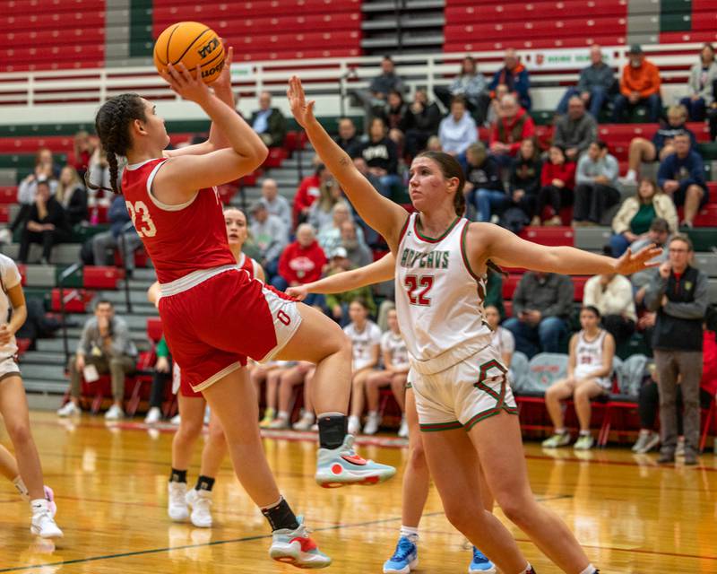 Mary Stisser (23) of Ottawa pulls up for midrange shot as Brianna Ruppert (22) of LaSalle-Peru puts hand up to contest on Wednesday, December 17, 2025 at Sellet Gymnasium in LaSalle.