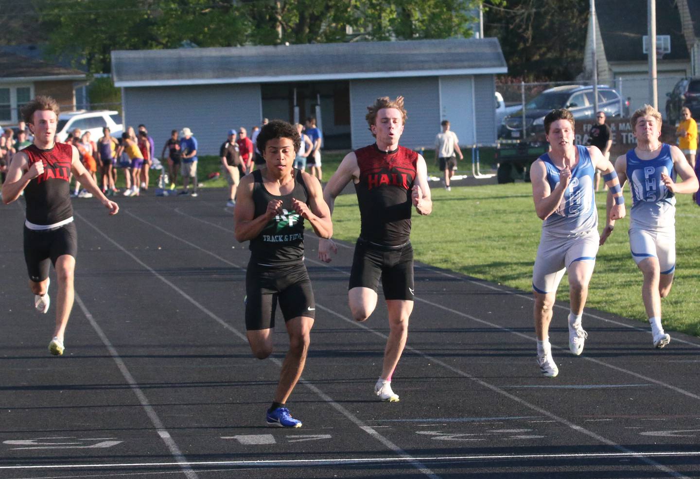 (From left) Hall's Joseph Bacidore, Rock Falls's Adan Oquendo, Hall's Caleb Bickett, Princeton's Evan Driscoll and Casey Etheridge compete in the 100 meter dash during the Ferris Invitational on Monday, April 15, 2024 at Princeton High School.