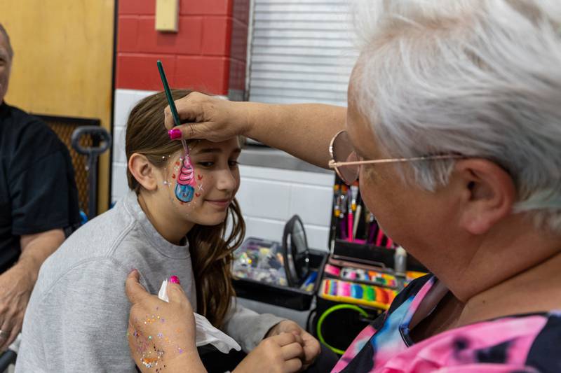 Phoenix Orseno gets face painted on Friday, May 2, 2025 at Northbrook School in Mendota.
