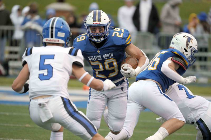 Brian Hill/bhill@dailyherald.com
Wheaton North's Walker Owens (29) looks for running room during the second round of the IHSA playoffs Saturday November 5, 2022 in Wheaton.