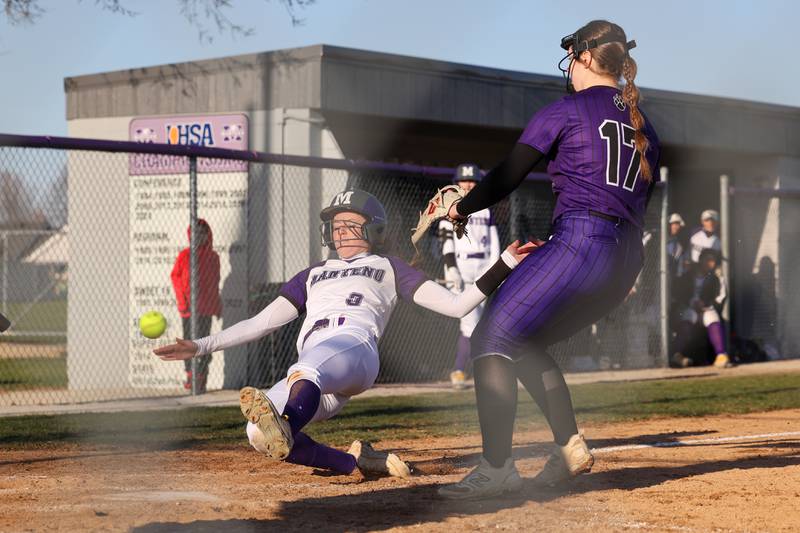 Manteno's Sophie Peterson safely slides into home as Wilmington's Lexi Strohm waits for the throw during the Panthers' 9-7 victory over the Wildcats on Tuesday, April 8, 2025.