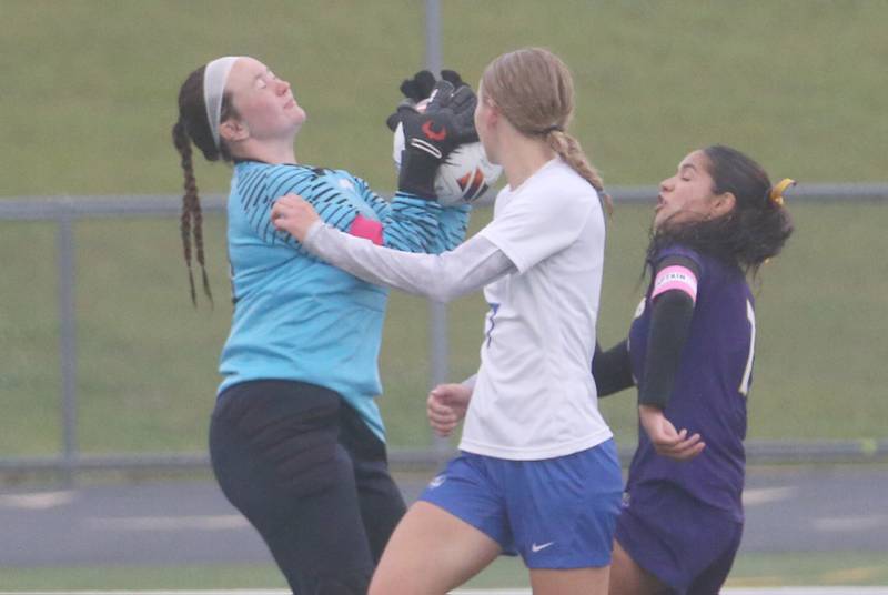 Princeton keeper Maddie Oertel blocks a shot from Mendota's Crystal Garcia as teammate Dein Dever (center) helps on the play during the Class 1A Regional final game on Tuesday, May 20, 2025 at Mendota High School.