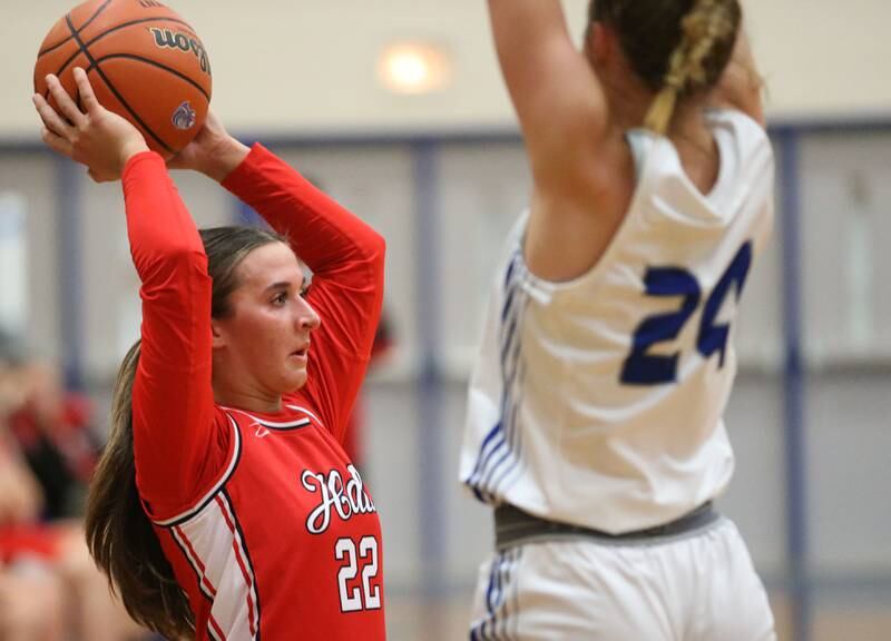 Hall's Kenedy Wozniak passes the ball off as Princeton's Keighley Davis defends during the Princeton Holiday Girls Basketball Tournament on Friday, Nov. 23, 2024 at Princeton High School.