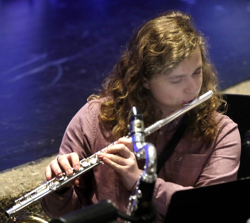 Gavin Wuchter plays the flute during a rehearsal for the McHenry Community High School’s production of “The SpongeBob Musical” on Tuesday, March 7, 2023, at the school’s Upper Campus.