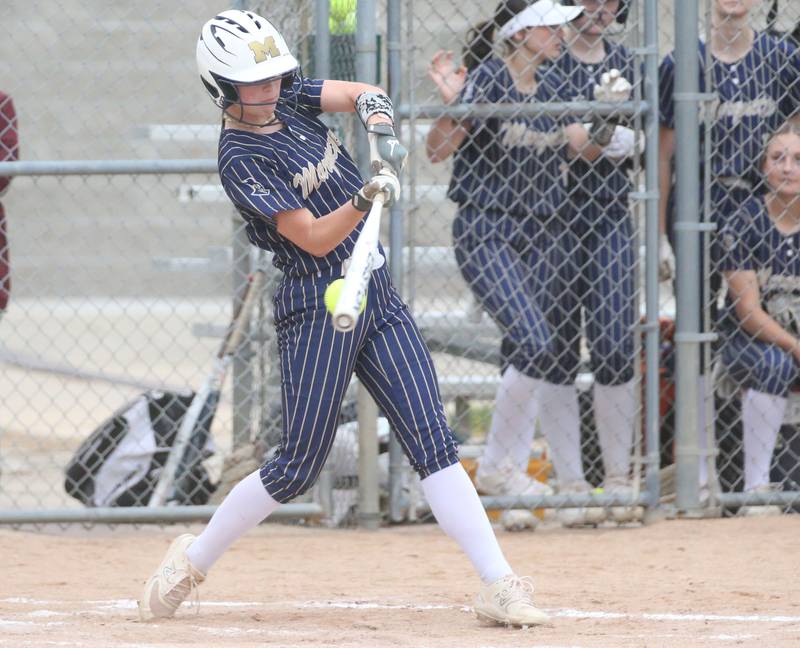 Marquette's Maisie Lyons swings and misses against St. Bede on Thursday, April 18, 2024 in Ottawa.