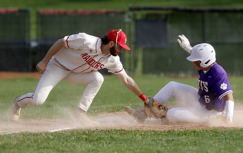 Huntley's Dylan Visvadra tries to tag Huntley's Josh Rudnick as Rudnick steals third base during a Fox Valley Conference baseball game on Monday, April 28, 2025, at Huntley High School.
