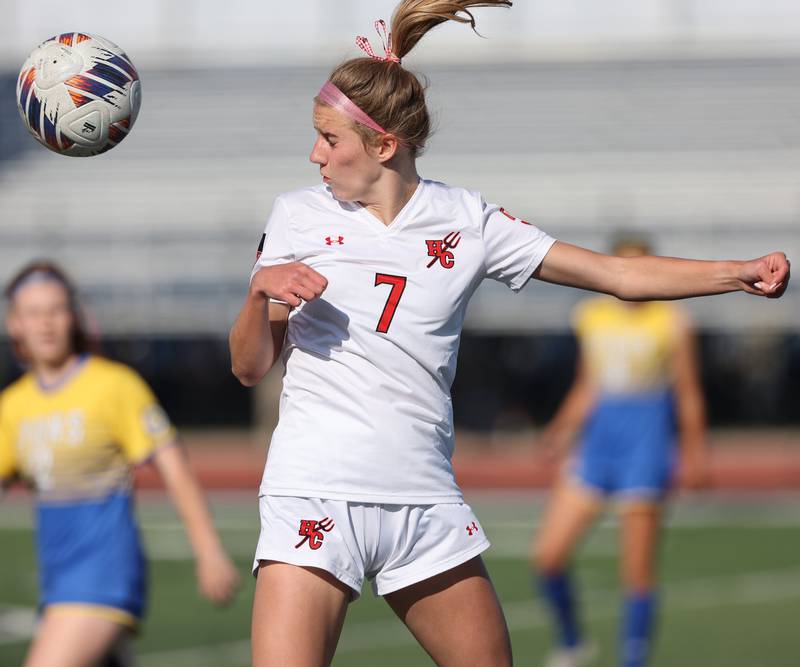 Hinsdale Central's Caroline Mortonson (7) heads the ball during the IHSA Class 3A girls soccer sectional final match between Lyons Township and Hinsdale Central at Reavis High School in Burbank on Friday, May 26, 2023.