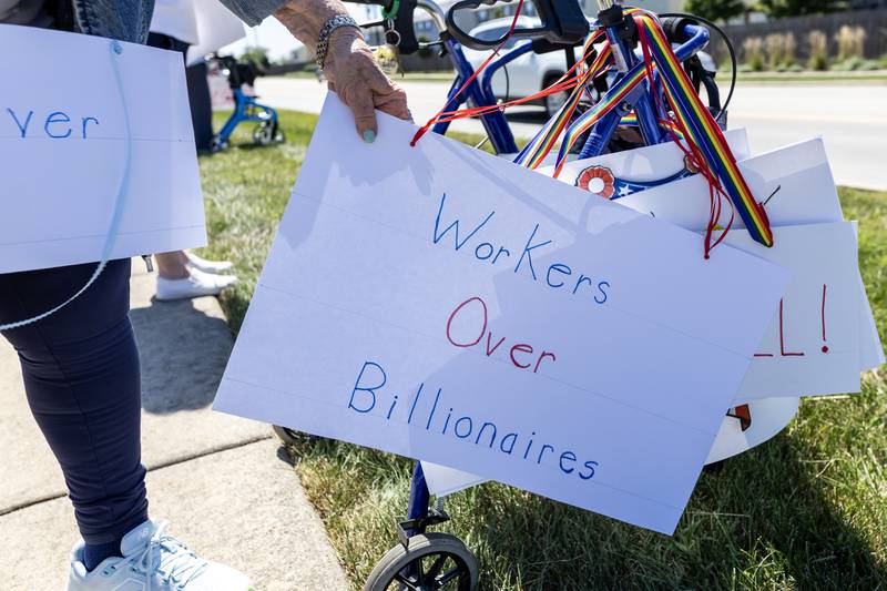 A sign reads ‘Workers Over Billionaires’ during the Labor Day Protest on the 1100 block of N. River Rd. in Shorewood, IL, on Sept. 1, 2025.