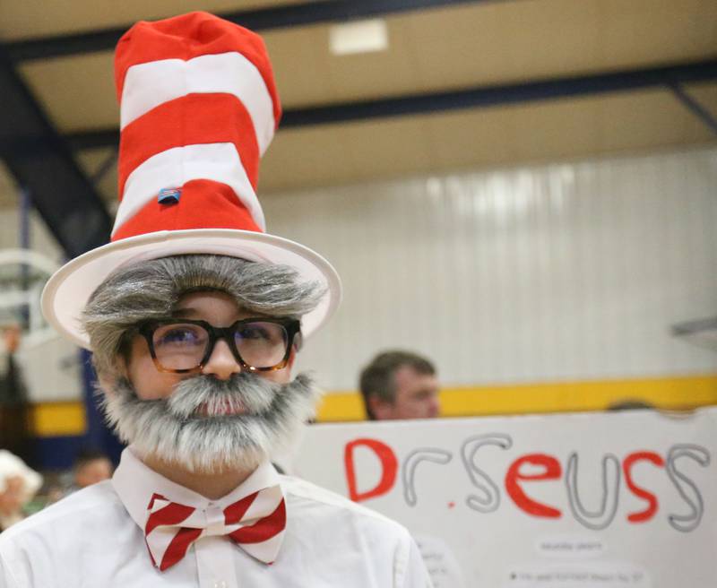 Eli Gabrys a sixth-grader at Logan Jr. High School, dresses as Dr. Seuss during a live Wax Museum on Thursday, Feb. 27, 2025 at Logan Jr. High School in Princeton. Students made poster boards and dressed like their featured character at the event.