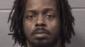 DeKalb man charged after police say they found him asleep inside his car with loaded gun
