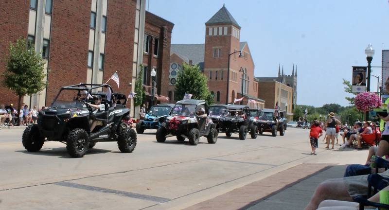 UTVs roll down South Peoria Avenue in Dixon on July 4, 2021, as part of the Petunia Festival parade.