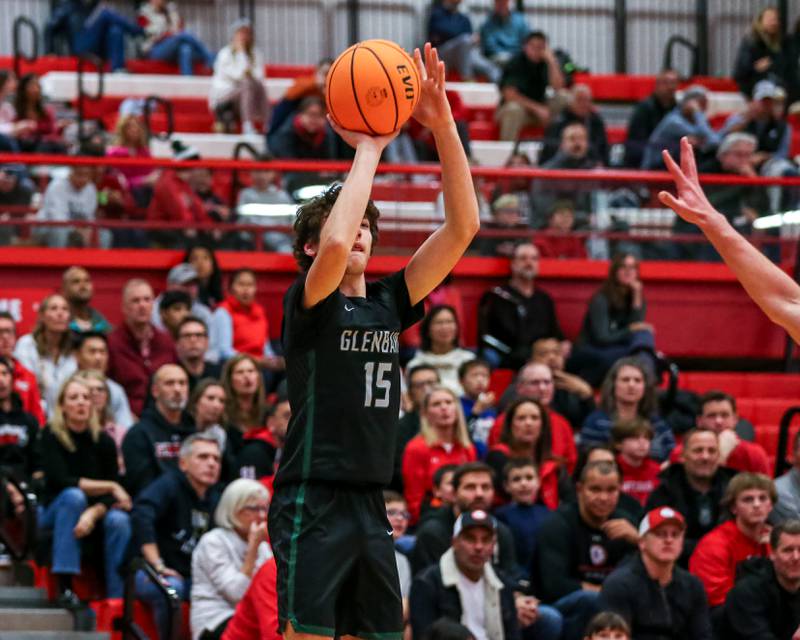 Glenbard West's Drew Gacek (15) shoots a jump shot during their basketball game between Glenbard West at Hinsdale Central, Friday  Dec 6, 2024  in Hinsdale.