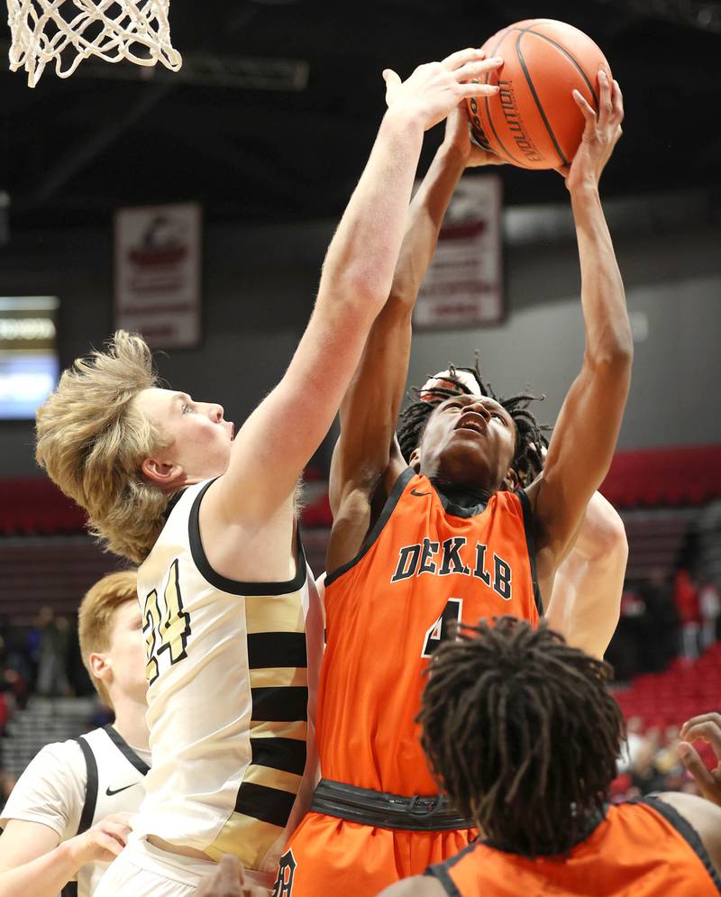 DeKalb's Johnny Henderson and Sycamore's Lucas Winburn go after a rebound during the First National Challenge Friday, Jan. 27, 2023, at The Convocation Center on the campus of Northern Illinois University in DeKalb.