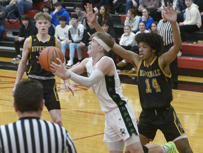 Seneca’s Paxton Giertz gets by Riverdale’s Aris Morgan and looks up to shoot during the 2nd period Friday at Regional Championship at Hall.