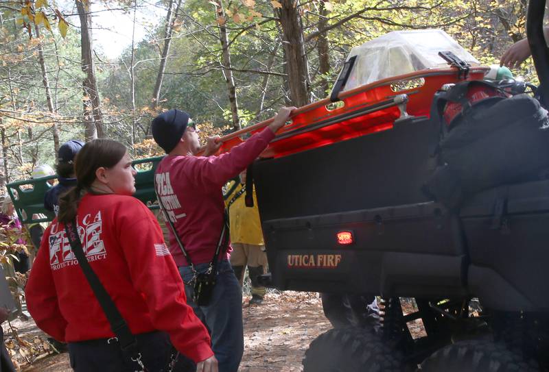 Utica and Oglesby firefighters and paramedics unload equipment to rescue a 16-year old male who fell approximately 30 feet in the area of Cedar Point overlook on Friday, Oct. 24, 2025  at Matthiessen State Park in Oglesby. Utica and Oglesby Fire and EMS responded to the park just before 1p.m. The 16-year old patient from Elmhurst, fell down part of an embankment. Rescuers transported him to the Matthiessen shelter using a six-wheeler and then transferred by ambulance to OSF St. Elizabeth Peru. The patent suffered non-life-threatening injuries.