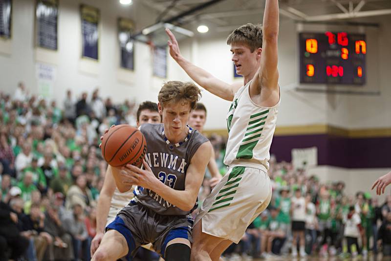 Newman's Lucas Simpson works below the basket against Scales Mound in the sectional final Friday, March 4, 2022.