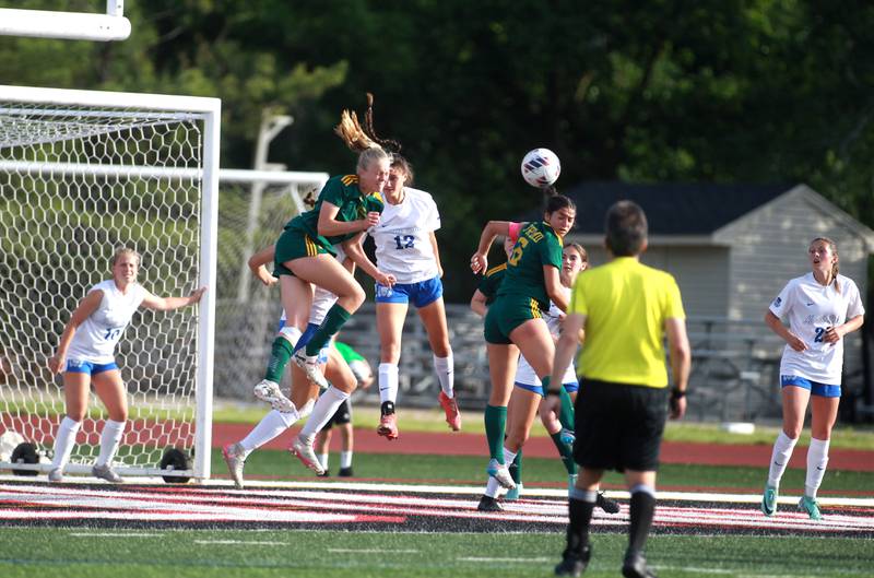 St. Charles North and Fremd players go after a corner kick during the Class 3A state semifinal game at North Central College in Naperville on Friday, May 31, 2024.