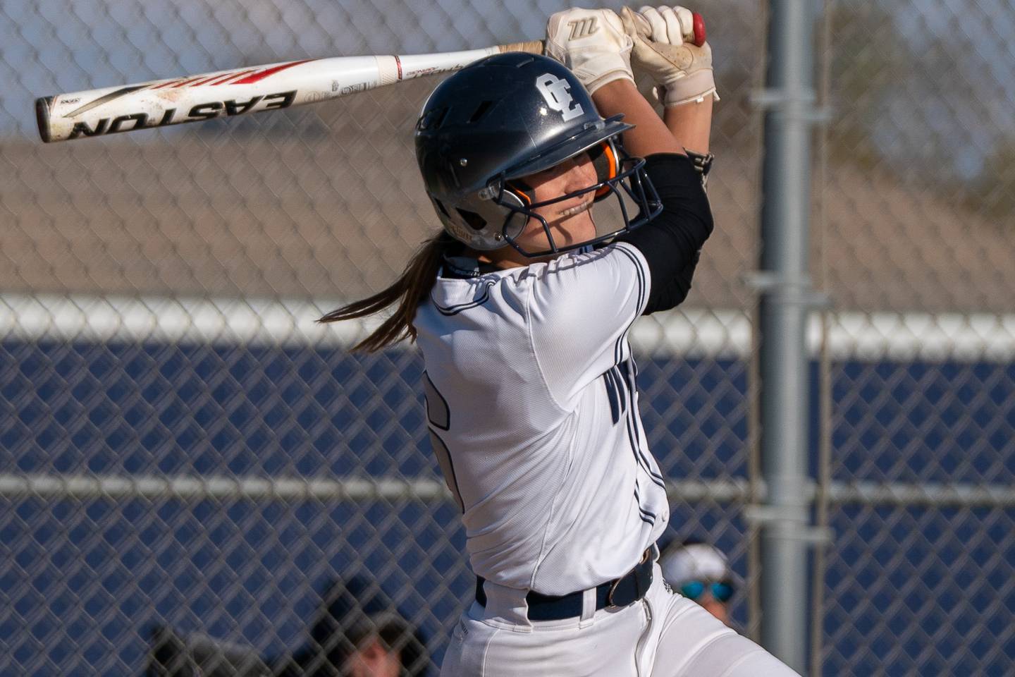 Oswego East's Ronnie Craft (6) singles driving in a run against Oswego during a softball game at Oswego East High School on Friday, April 21, 2023.